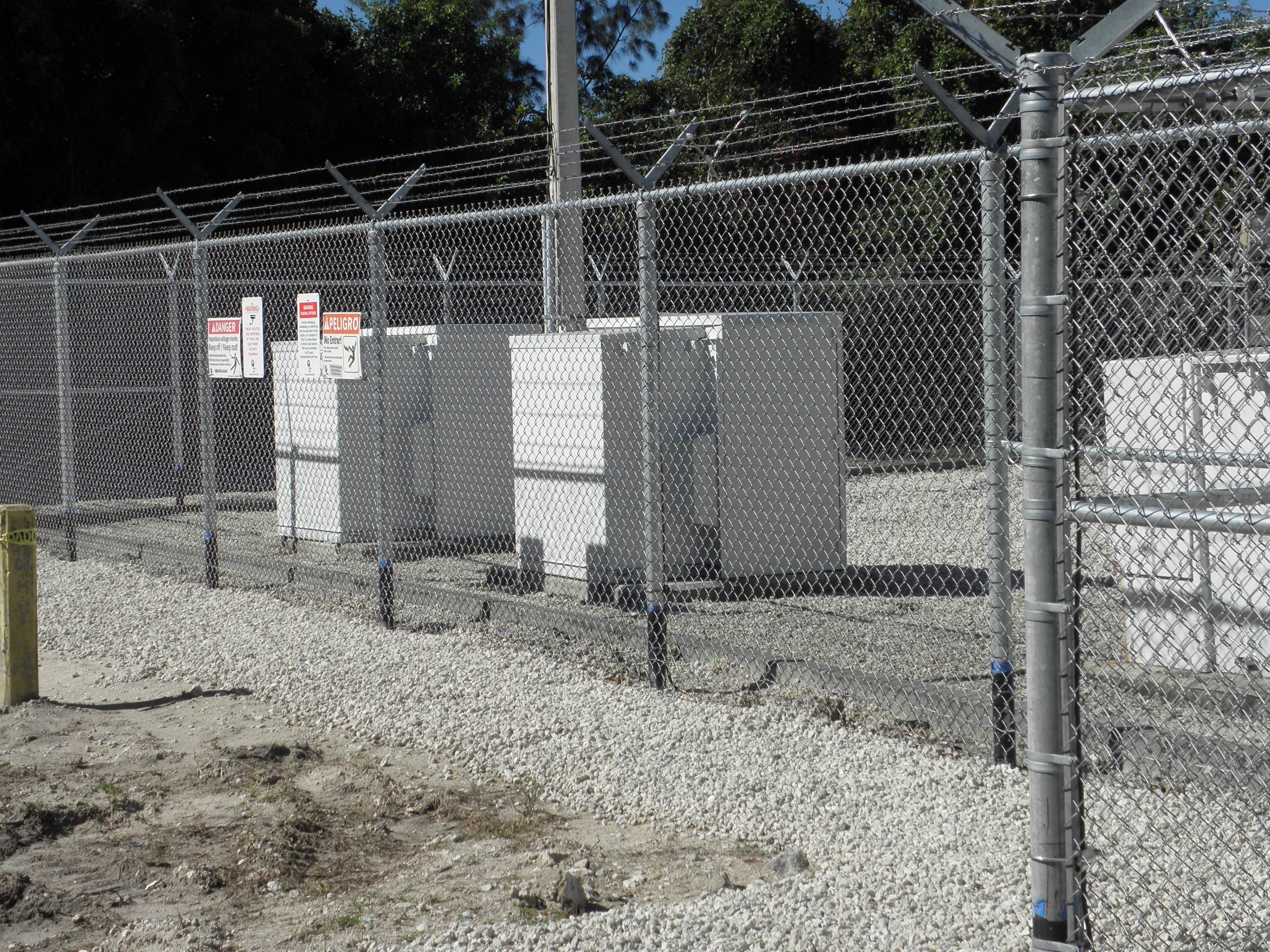Chain link enclosure and gate installation on site